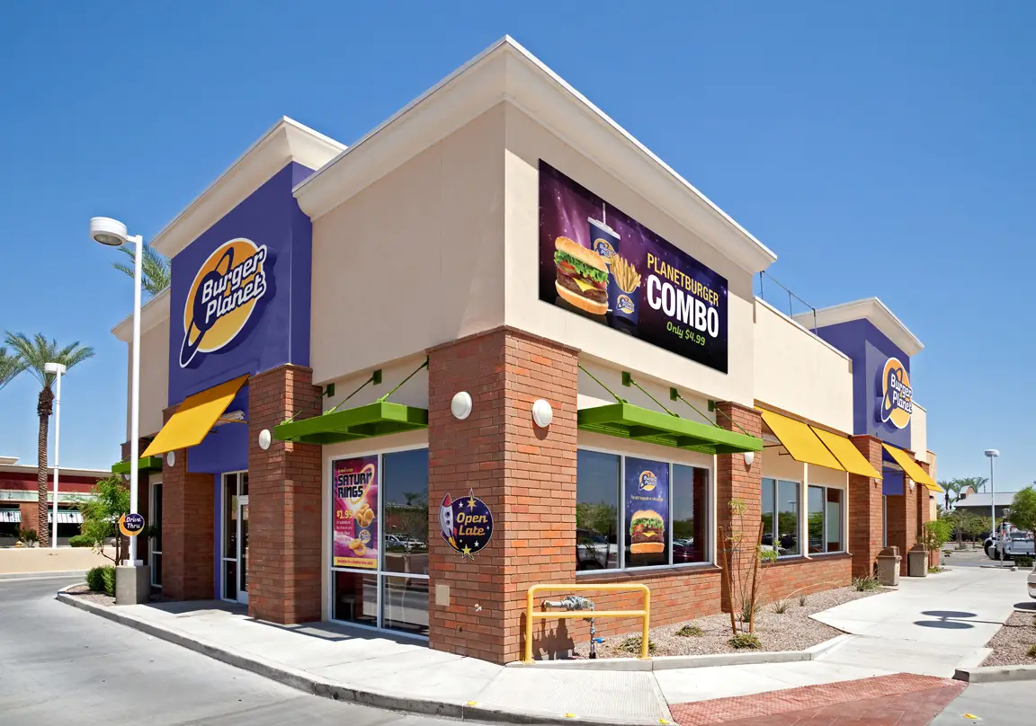 A fast food restaurant with lots of colorful signage