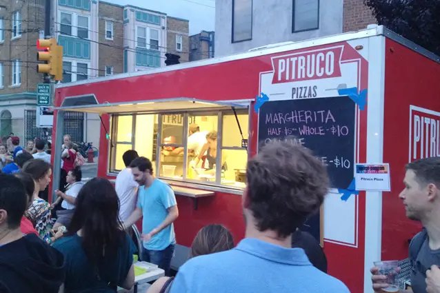 A food truck wrapped with graphics