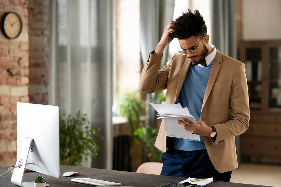 A man frustrated over receiving duplicate mailings