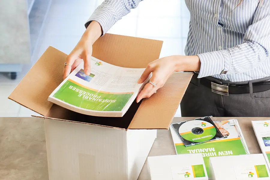 Worker putting items in a box