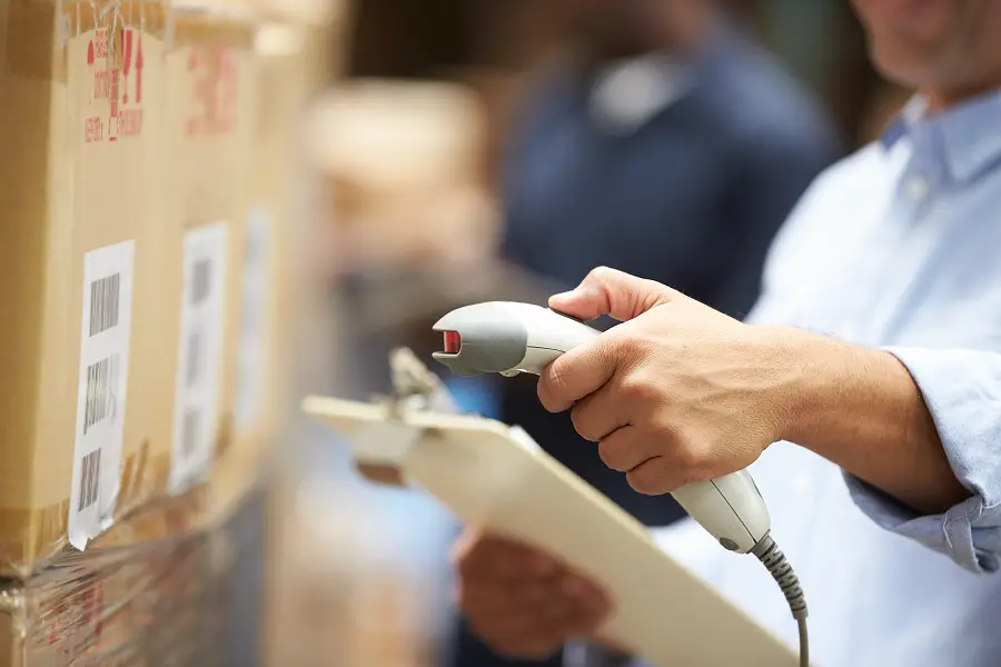 Worker scanning a box